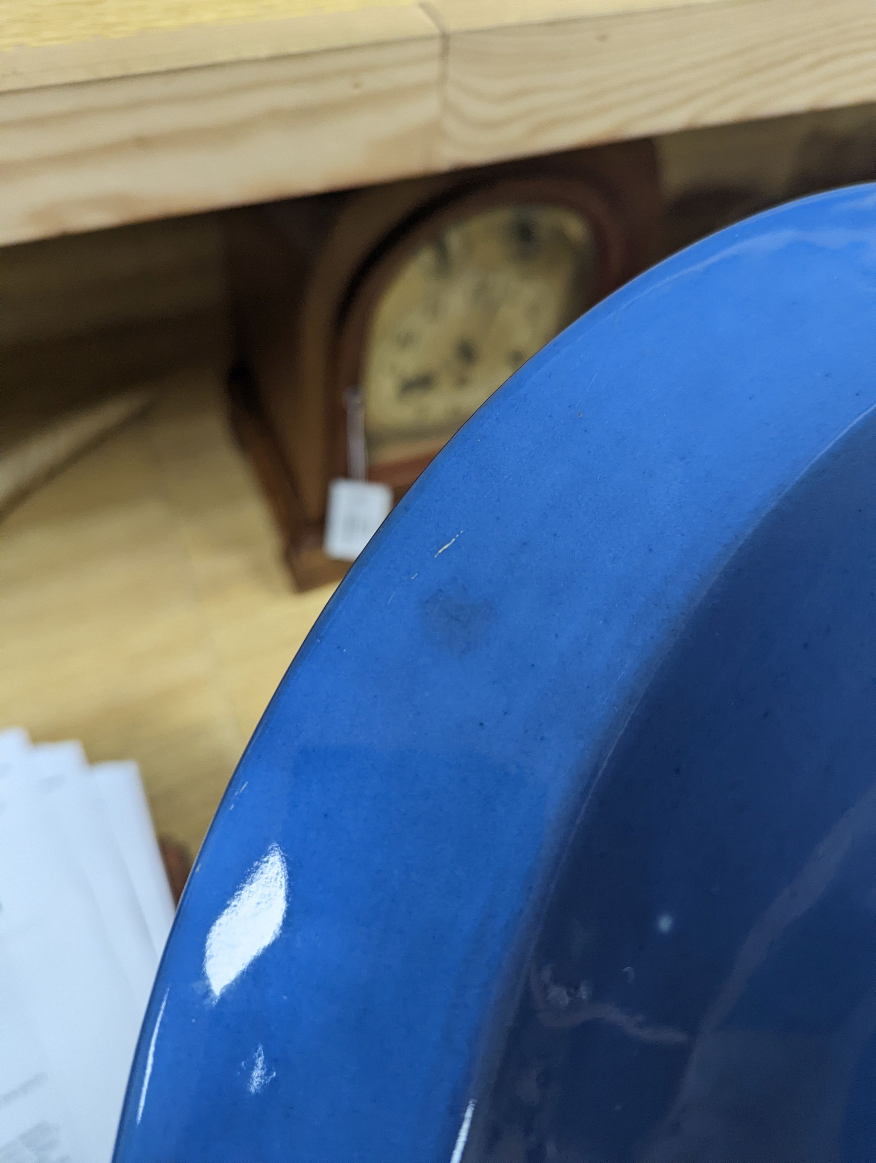 A Chinese export slip decorated blue ground basin, c.1830 - 40cm diameter